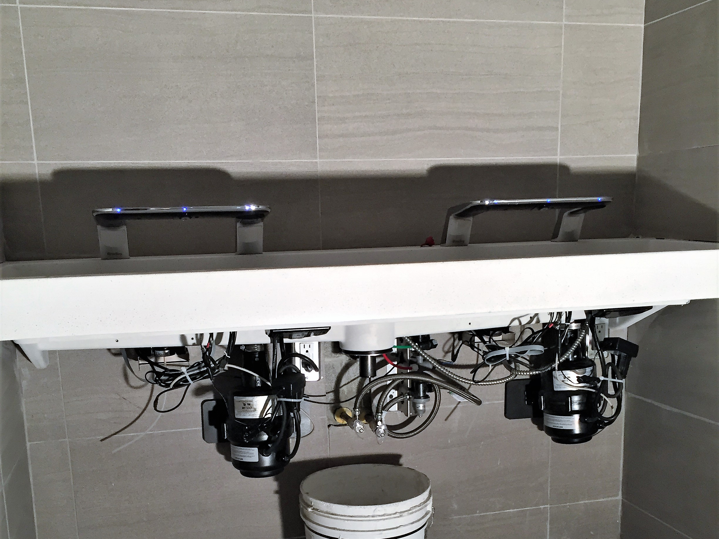 Sink and fixture installation in commercial bathroom